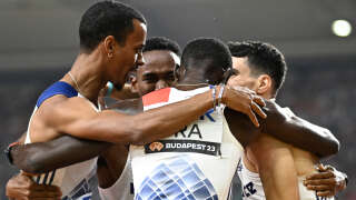 France's David Sombe (L), Ludvy Vaillant (C front), Gilles Biron (C behind), and France's Teo Andant (R) celebrate together after finishing second in the men's 4x400m relay final during the World Athletics Championships at the National Athletics Centre in Budapest on August 27, 2023. (Photo by Jewel SAMAD / AFP)