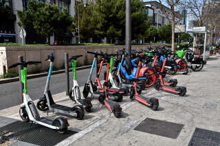 MARSEILLE, FRANCE - 2023/03/23: Electric scooters and bicycles are seen on a sidewalk in Marseille. Many operators share the e-scooter and e-bike market in Marseille. These operators are such as Bird, Voi, Lime, and recently added, Dott. (Photo by Gerard Bottino/SOPA Images/LightRocket via Getty Images)