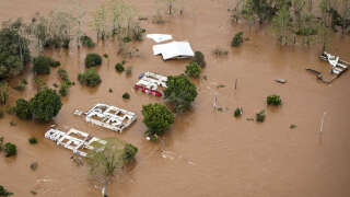 Aerial view of the area affected by an extratropical cyclone in Muçum, Rio Grande do Sul State, Brazil, taken on September 5, 2023. Torrential rain and winds caused by an extratropical cyclone have left at least 21 people dead in southern Brazil, officials said Tuesday, warning more flooding may be coming. The latest in a string of weather disasters to hit Brazil, it is the deadliest ever in the state of Rio Grande do Sul, Governor Eduardo Leite told a news conference. (Photo by Mateus BRUXEL / AGENCIA RBS / AFP) / Brazil OUT