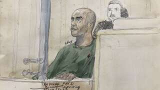 This courtsketch made on September 5, 2023, shows French armed robber Redoine Faid as he attends the opening of his trial over an escape from prison in 2018, at the Palais de Justice courthouse in Paris. French armed robber Redoine Faid goes on trial on September 5 with 11 other defendants over his spectacular and rapid escape in a helicopter from the Reau prison in 2018, his second espace in five years. (Photo by Benoit PEYRUCQ / AFP) / ----IMAGE RESTRICTED TO EDITORIAL USE - STRICTLY NO COMMERCIAL USE-----