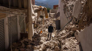 MOULAY BRAHIM, MOROCCO - SEPTEMBER 10: A man walks amongst the rubble of collapsed buildings following yesterday's earthquake, on September 10, 2023 in Moulay Brahim, Morocco. A huge earthquake measuring 6.8 on the Richter scale has hit central Morocco. Whilst the epicentre was in a sparsely populated area of the High Atlas Mountains, its effects have been felt 71km away in Marrakesh, a major tourist destination, where many buildings have collapsed and thousands of deaths have been reported. (Photo by Carl Court/Getty Images)