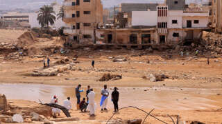 Rescue teams assist in relief work in Libya's eastern city of Derna September 17, 2023 following deadly flash floods. A week after a tsunami-sized flash flood devastated the Libyan coastal city of Derna, sweeping thousands to their deaths, the international aid effort to help the grieving survivors slowly gathered pace. (Photo by KARIM SAHIB / AFP)