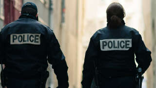 Paris, France - April 2012: A pair of police officers with the word 