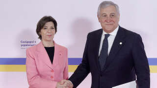 French Foreign and European Affairs Minister Catherine Colonna (L) poses with Italy's Foreign Minister Antonio Tajani (R) as he arrives prior to the 