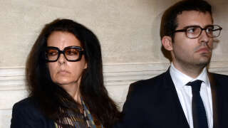 Françoise Bettencourt-Meyers (L), daughter of France's richest woman Liliane Bettencourt, and his son Nicolas, prepare to speak to journalists on May 28, 2015 at the Bordeaux courthouse, southwestern France, after the deliberations of the tribunal in his trial for allegedly exploiting France's richest woman Liliane Bettencourt. 10 members of Bettencourt's entourage are accused of taking advantage of the 92-year-old billionaire's growing mental fragility in an explosive legal and political drama.AFP PHOTO / JEAN-PIERRE MULLER (Photo by JEAN-PIERRE MULLER / AFP)