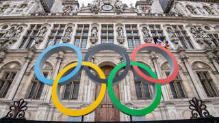 This general view shows the Olympic rings on display in front of The City Hall in Paris on March 13, 2023, ahead of the 2024 Olympic Games. In 500 days, the 2024 Summer Olympics will burst into life in Paris as the teams float down the River Seine on barges in a unique opening ceremony for a games that will involve the return of full crowds of spectators to the world's greatest sporting spectacle after the Covid-blighted Summer Games in Tokyo in 2021 and the Winter Olympics in Beijing last year. (Photo by ALAIN JOCARD / AFP)