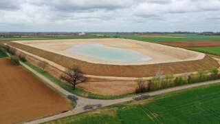 This aerial view taken on April 11, 2023 shows a water reserve for agricultural irrigation under construction, in Sainte-Soline, central-western France. The project comprises 16 reservoirs with a total capacity of six million cubic metres, planned by a cooperative of 450 farmers with state support. It aims to store water drawn from the water table in winter to irrigate crops in summer when rainfall is scarce, according to a 