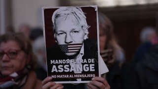 A sign and message with Julian Assange's face during a demonstration in Madrid on February 20, 2024 