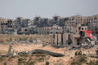 A general view shows damaged buildings in the area around Nasser hospital in Khan Yunis in the southern Gaza Strip on March 24, 2024, as battles continue between Hamas militants and Israeli forces in the besieged Palestinian territory. Israeli troops and tanks have encircled Gaza City's Al-Shifa Hospital, the territory's biggest, for a week and more recently moved on the Al-Amal Hospital in Khan Yunis, with the Red Crescent adding on March 24 that military vehicles had also surrounded the nearby Nasser hospital, where the situation remained unclear. (Photo by AFP)