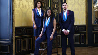 (From L) France's athletes Estelle Mossely, Gloria Agblemagnon and Nando De Colo wearing the official Berluti France suit pose during a photo session in Paris on March 12, 2024. Suit, shirt, belt, shoes, scarf, pocket square... The athletes of the French team will be dressed in Berluti from head to toe for the opening ceremonies of the Olympic and Paralympic Games, with outfits unveiled on April 17, 2024, by the brand of LVMH, premium partner of the Games. (Photo by Anne-Christine POUJOULAT / AFP)