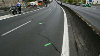 This photograph taken on April 19, 2024, shows a view of cracks on the closed A13 highway in Saint-Cloud, west of Paris. The A13 freeway between the Paris ring road and the A86 has been closed in both directions since April 18, 2024 evening for an indefinite period, due to 