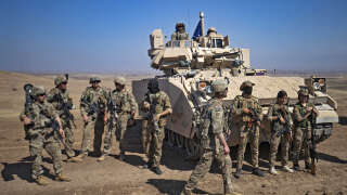 Soldats américains et syriens dans le cadre d’une opération de la coalition internationale antijihadiste dirigée par les États-Unis, le 7 septembre 2022.