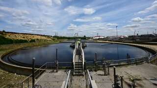 This photograph taken on July 12, 2023 shows a view of the Seine-Valenton wastewater treatment plant of the the greater Paris Sanitation Authority SIAAP (Syndicat Interdepartemental pour l'Assainissement de l'Agglomeration Parisienne) in Valenton, south-east of Paris. The ongoing work to disinfect water discharges from the SIAAP water treatment plants is aimed at lowering the concentration of bacteria to reach the bathing quality threshold that will allow athletes of the 2024 Olympic Games to compete in the Seine. After the Olympic Games, residents of the Ile-de-France region will be able to swim in the Seine and its tributary the Marne at 23 bathing sites, including 5 in Paris. (Photo by Emmanuel DUNAND / AFP)