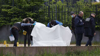 Officers of the judicial police examine the scene where two men were shot dead, in Sevran, northern Paris, on May 5, 2024. Two men were shot dead in Sevran on May 5, 2024, less than 48 hours after a shooting linked to drug trafficking left one man dead and several others seriously injured in the Seine-Saint-Denis town, police sources told AFP. (Photo by Geoffroy VAN DER HASSELT / AFP)