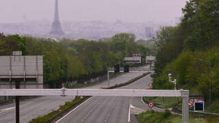 (FILES) This photograph taken on April 19, 2024, shows a view of the empty and closed A13 highway, with the Eiffel Tower in the background in Versailles, west of Paris. Part of the A13 highway located between the Paris ring road and the A86, closed since April 18, 2024 will reopen from Saturday May 11, 2024 