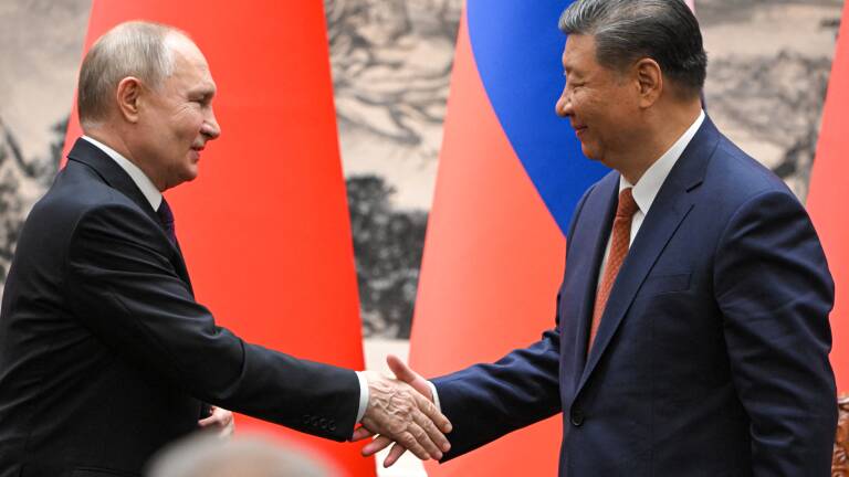 In this pool photograph distributed by the Russian state agency Sputnik, Russia's President Vladimir Putin and China's President Xi Jinping shake hands during a signing ceremony following their talks in Beijing on May 16, 2024. (Photo by Sergei GUNEYEV / POOL / AFP) / ** Editor's note : this image is distributed by Russian state owned agency Sputnik **