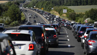 Vehicles sit in congested traffic along the A10 highway on the summer vacation route, in the suburbs Paris, on August 6, 2022. France has recorded heavy traffic congestion throughout the country on one of the busiest travel days of the year - known as the 