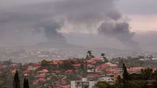 A view of the Motor Pool district of Noumea on May 15, 2024, amid protests linked to a debate on a constitutional bill aimed at enlarging the electorate for upcoming elections of the overseas French territory of New Caledonia. One person was killed, hundreds more were injured, shops were looted and public buildings torched during a second night of rioting in New Caledonia, authorities said Wednesday, as anger over constitutional reforms from Paris boiled over. (Photo by Delphine Mayeur / AFP)