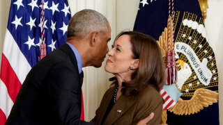 Former President Barack Obama embraces US Vice President Kamala Harris while arriving to deliver remarks on the Affordable Care Act and Medicaid in the East Room of the White House in Washington, DC, on April 5, 2022. (Photo by MANDEL NGAN / AFP)